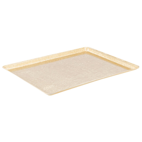 A white rectangular MFG Tray with gold trim on the edges.