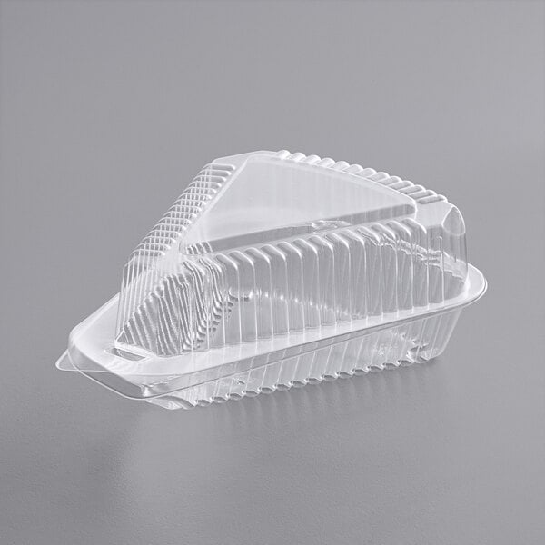A Choice clear plastic slice container with a low dome lid.