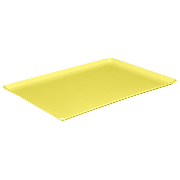 A yellow rectangular MFG Tray on a white surface.
