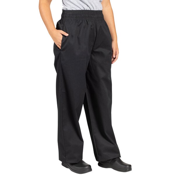 A person wearing Uncommon Chef black chef pants.