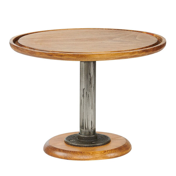 A round wooden Cal-Mil pedestal cake stand with a metal base.