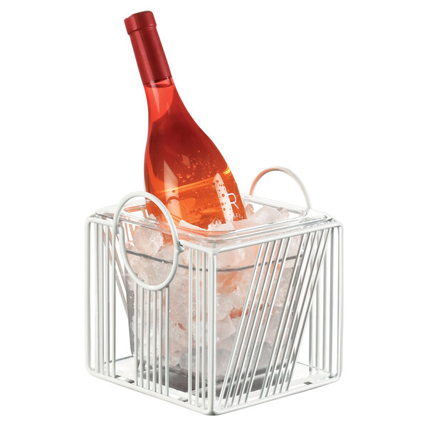 A Cal-Mil Portland white metal ice housing basket with a bottle in ice.
