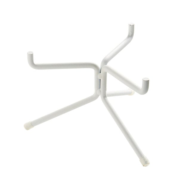 A white Cal-Mil metal plate stand with two legs and four hooks.