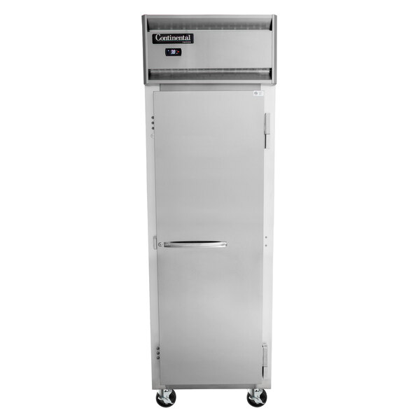 A Continental Refrigerator reach-in freezer with a solid door on wheels.