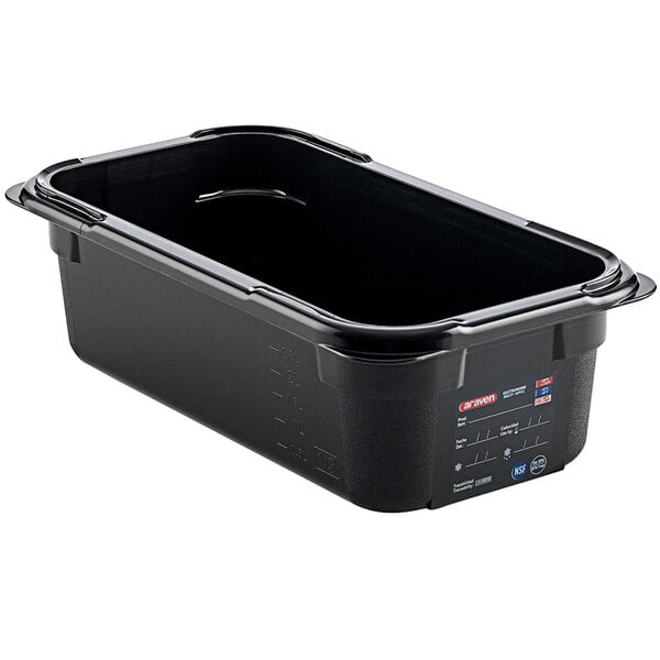 An Araven black plastic food pan with a lid on it.