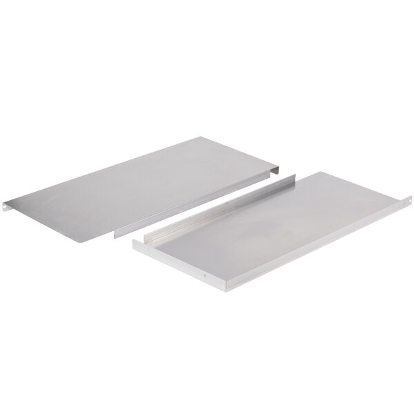 Two metal plates with a silver finish on a white surface.