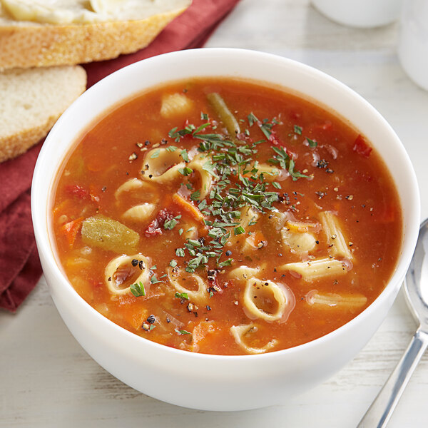 A bowl of Knorr Minestrone Soup with pasta and vegetables.