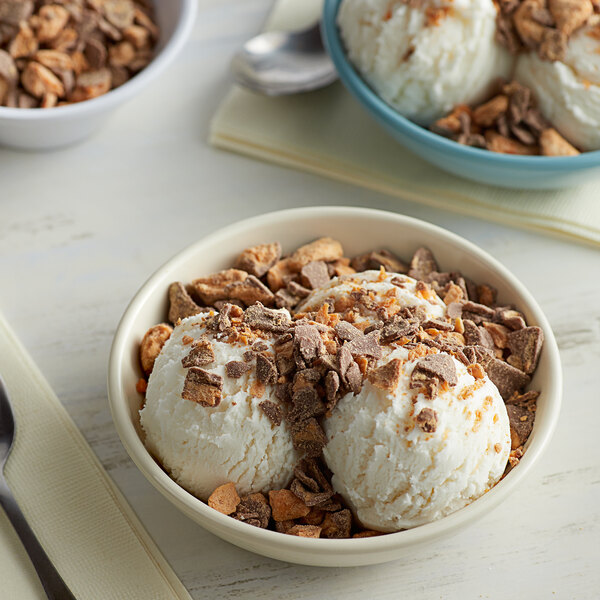 A bowl of ice cream with BUTTERFINGER® pieces.