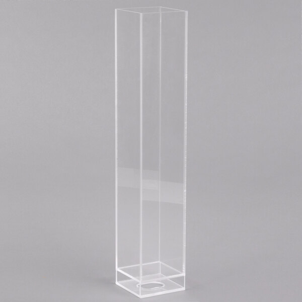 A clear rectangular ice chamber with vertical lines.