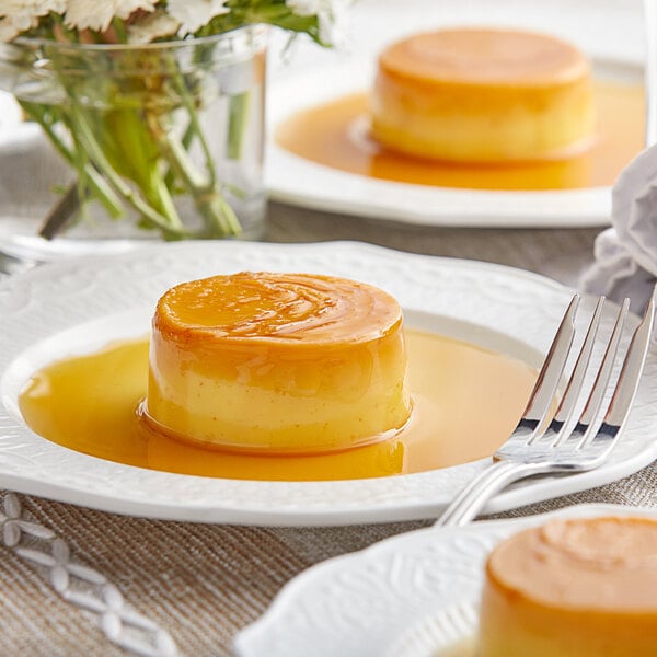 A plate of Knorr cream caramel flan with a fork on it.