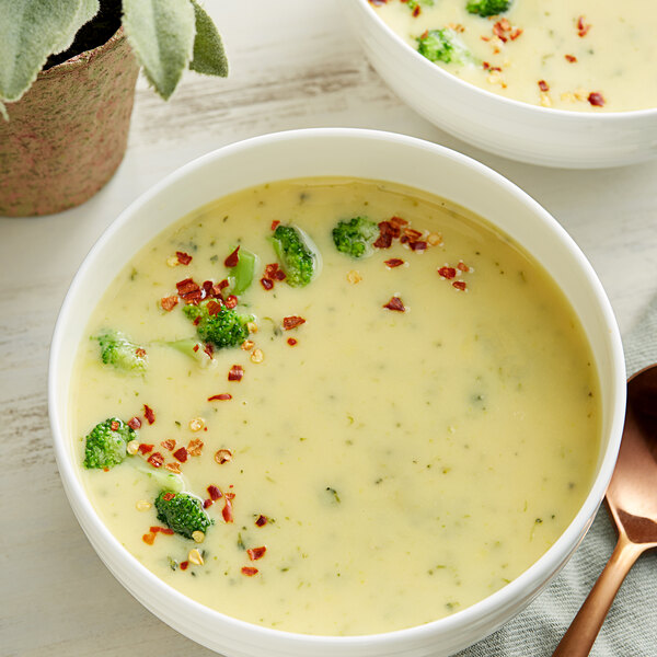 A bowl of Knorr Broccoli Cheese soup with broccoli.