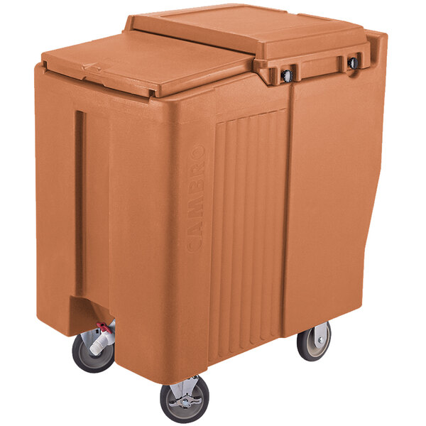A brown Cambro mobile ice bin with a sliding lid and wheels.