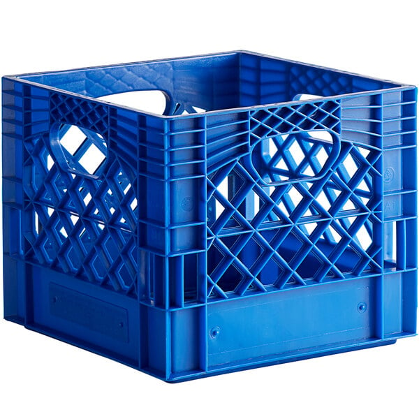 A blue plastic milk crate with holes and handles.