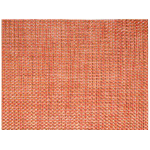 A close-up of the Front of the House Metroweave apricot mesh woven vinyl placemat with an orange and white woven pattern.