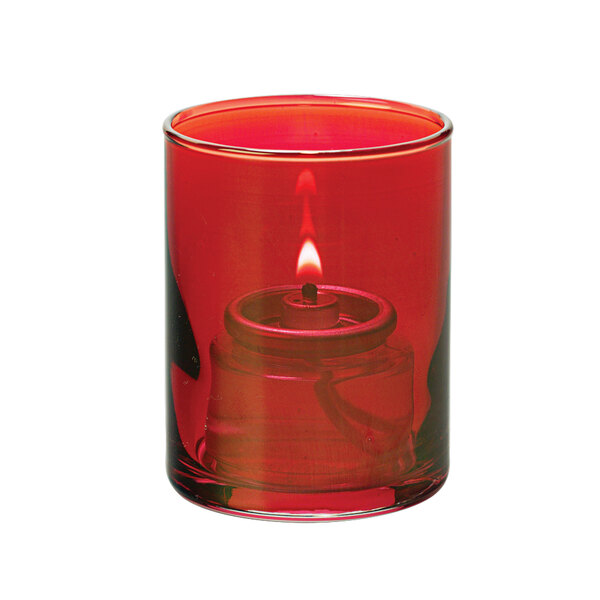 A ruby red glass cylinder tealight with a lit candle inside.