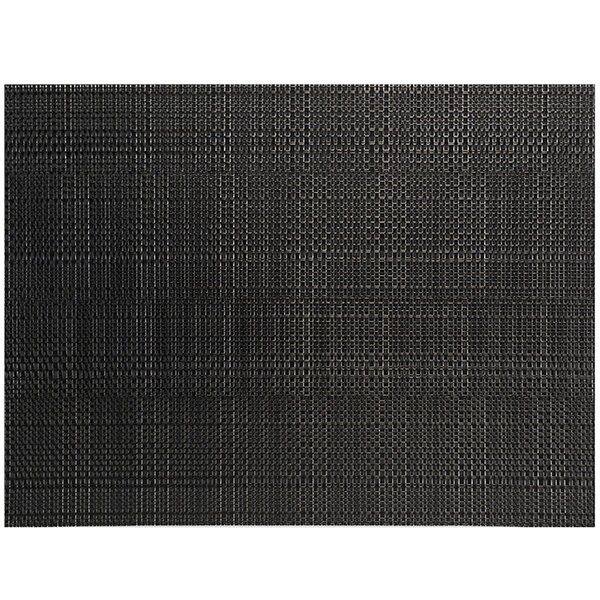 A close-up of a black woven rectangular placemat with a random weave pattern.