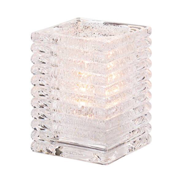 A Hollowick clear glass square candle holder with a light inside.