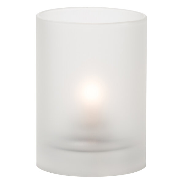 A Hollowick satin crystal glass cylinder candle holder with a lit candle on a white background.