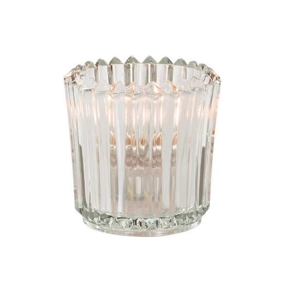 A close-up of a Hollowick clear glass ribbed tealight candle holder.