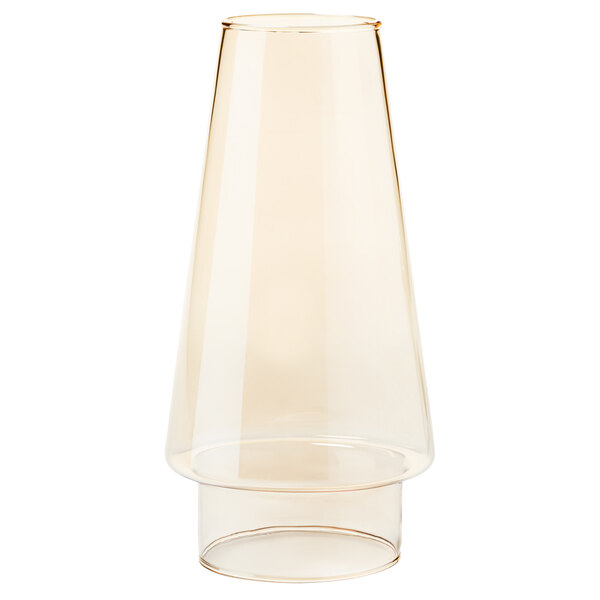 A clear glass conical chimney globe with a yellow liquid inside.