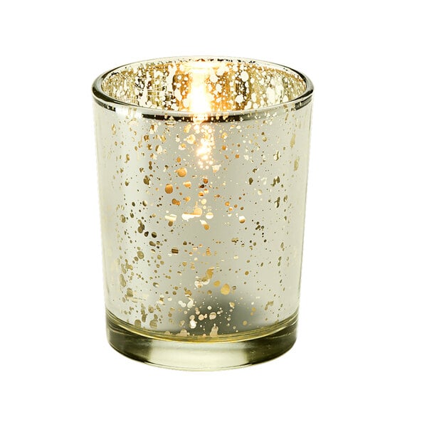 A Hollowick glass tealight holder with a lit white candle inside.