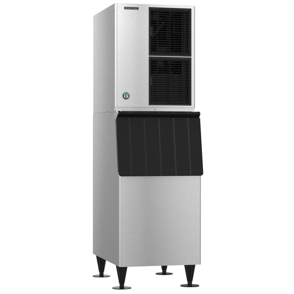 A Hoshizaki air cooled ice machine with a stainless steel finish and black door.