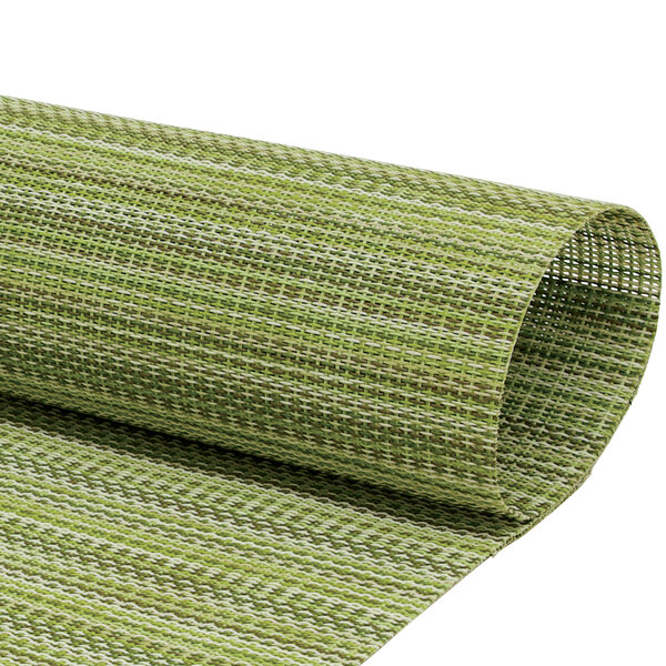 A rolled up green mesh woven vinyl rectangle placemat with green and white stripes.