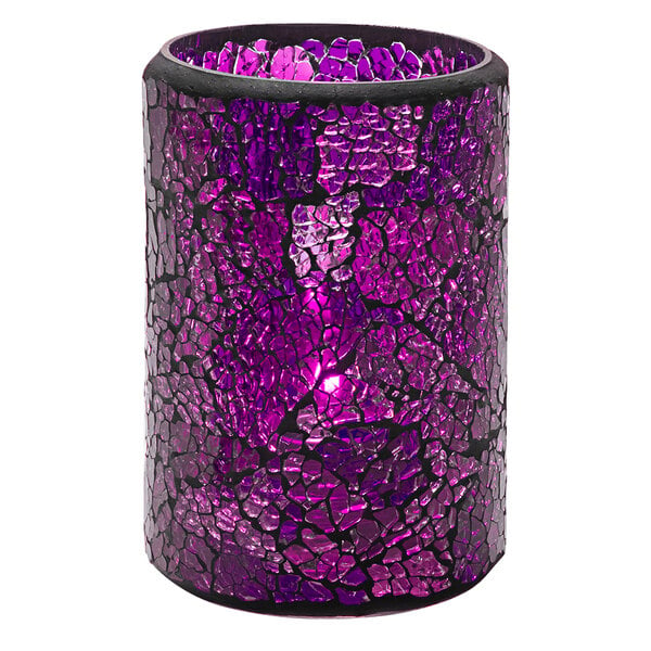 A blue and purple cracked glass cylinder candle holder with a lit candle inside.