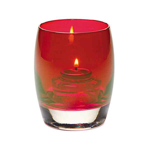 A Hollowick ruby glass votive with a lit candle inside.