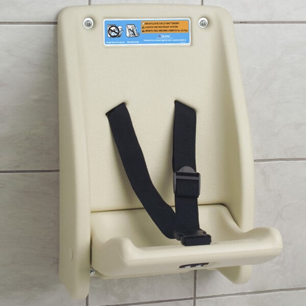 A cream Koala Kare child protection seat with a black strap and buckle.