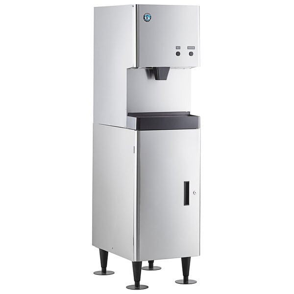 A stainless steel Hoshizaki ice machine with a water dispenser on a floor stand.