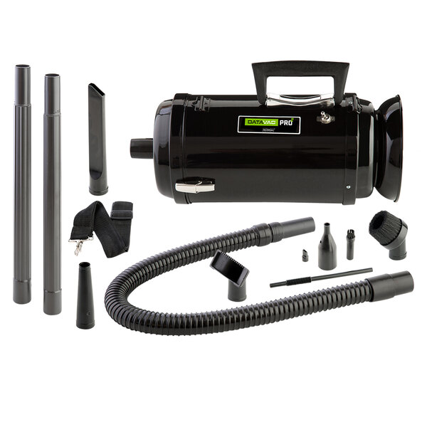 A black MetroVac canister vacuum with hoses and attachments.