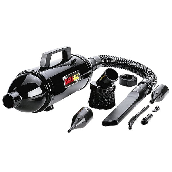 A black MetroVac handheld canister vacuum with various accessories.