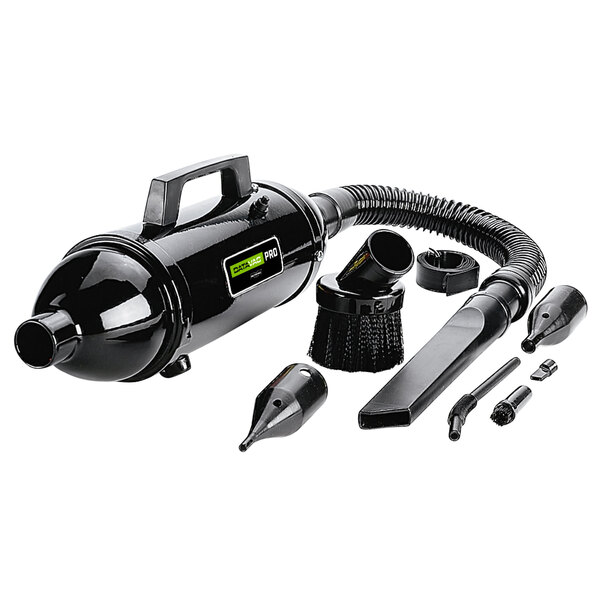 A black MetroVac canister vacuum with hose and nozzles.