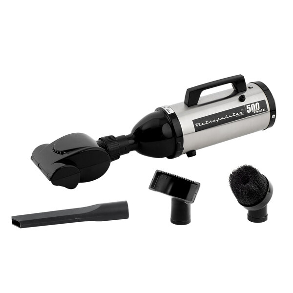 A black and silver MetroVac handheld canister vacuum cleaner with two attachments.