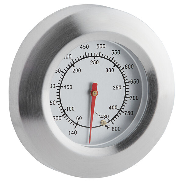 A close-up of a Backyard Pro stainless steel thermometer with a red dial.