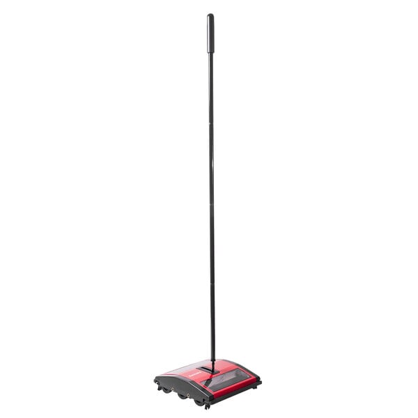 A red and black Sanitaire manual floor sweeper with a clear window.