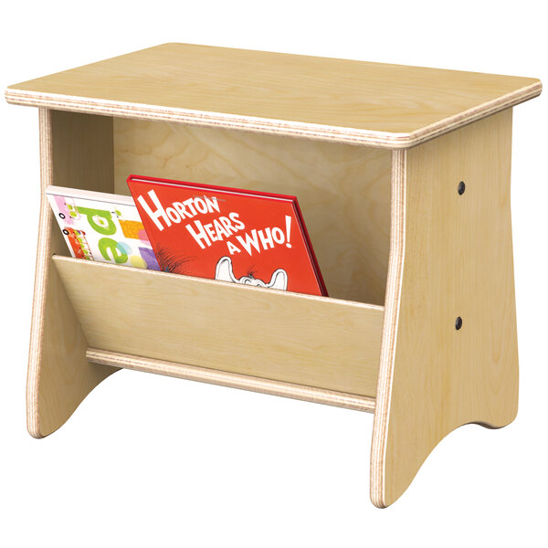 A Jonti-Craft children's wood end table with a book on it.
