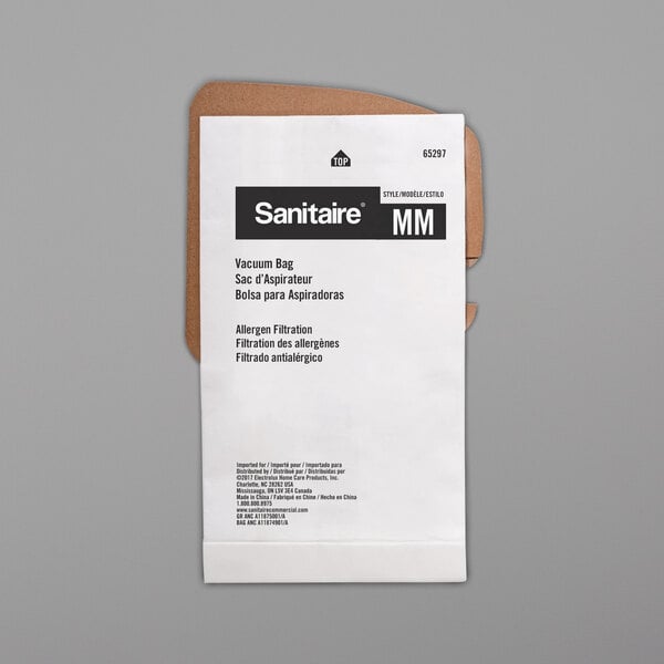 A white paper Sanitaire vacuum bag with black text on it.
