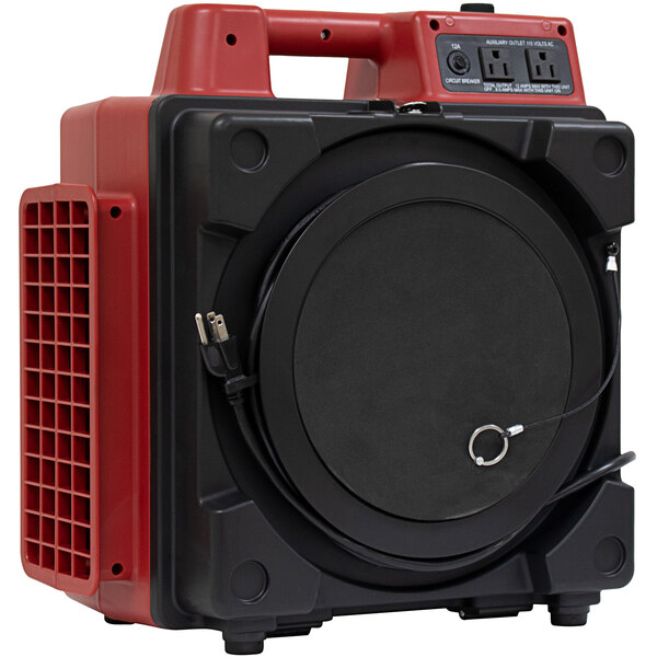 A red and black XPOWER commercial air purifier with a power outlet.