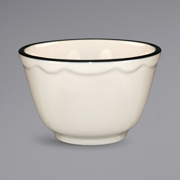 An International Tableware Sydney ivory stoneware bowl with a black rim.