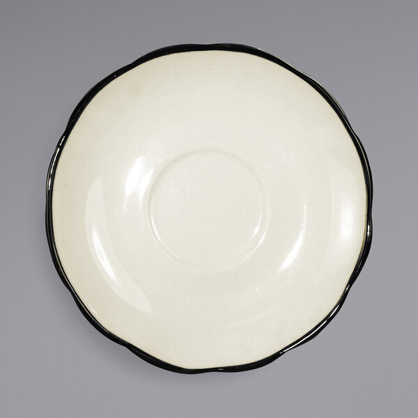 A white International Tableware Sydney stoneware saucer with a black rim.