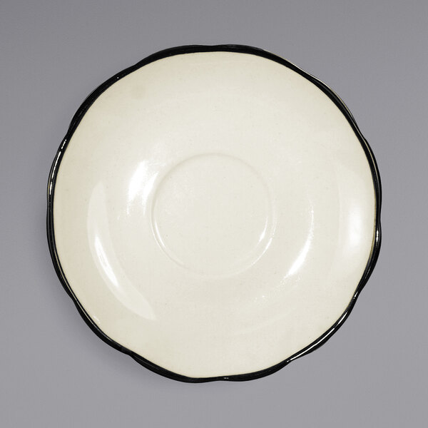 A white International Tableware stoneware saucer with a black rim.