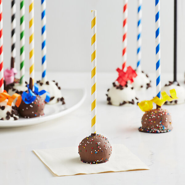EcoChoice gold stripe paper cake pops with straws on a white surface.