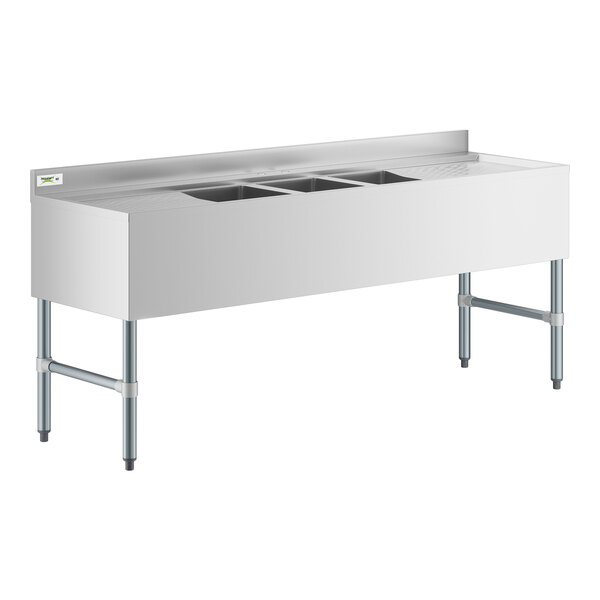 A Regency stainless steel underbar sink with two drainboards.