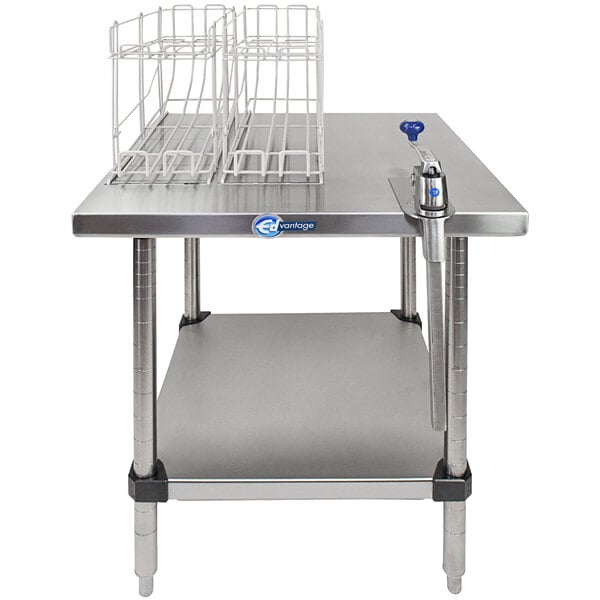 An Edlund stationary can opening station with a white rack on a metal table.