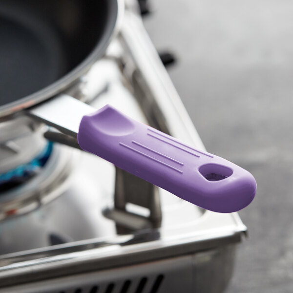 A purple Choice silicone pan handle sleeve on a pan.