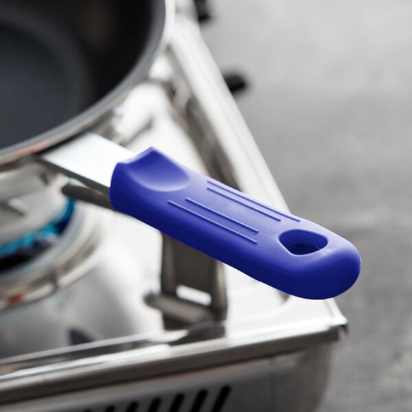 A blue silicone pan handle sleeve on a pan.