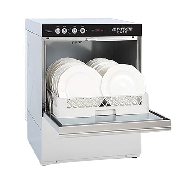 A Jet Tech undercounter dishwasher with white plates inside.