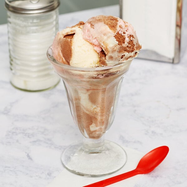 A Libbey Sundae Glass filled with brown and white ice cream.